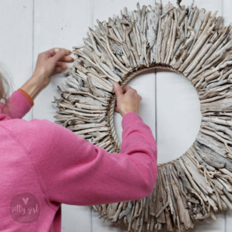 Sarah Legere creating a driftwood wreath at Maine Salty Girl