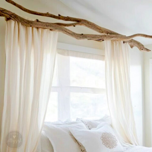 Driftwood branch above bed